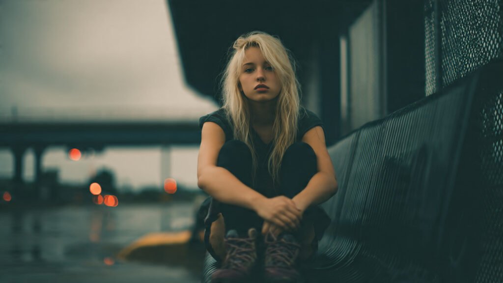 Strong girl facing loneliness alone